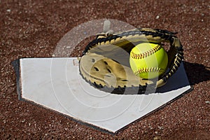 Fastpitch Catchers Mitt With Ball On Homeplate