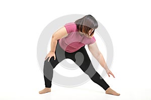 Fat Asian woman exercising Do stretches of arms and legs.