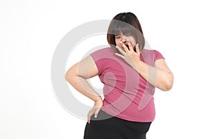 Fat asian woman Wear purple workout clothes in a shocking pose.