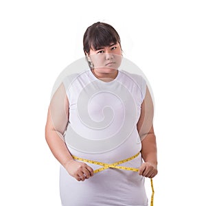 Fat Asian woman wear white t-shirt and checking her body size wi