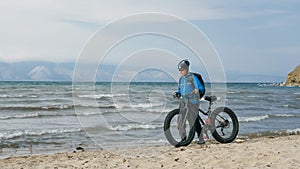 Fat bike also called fatbike or fat-tire bike in summer driving on the beach.