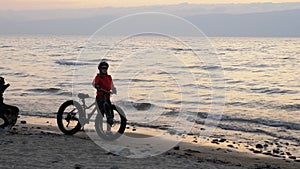 Fat bike also called fatbike or fat-tire bike in summer driving on the beach.