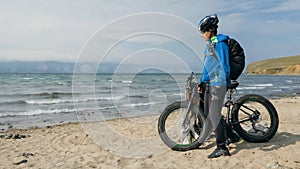 Fat bike also called fatbike or fat-tire bike in summer driving on the beach.