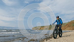 Fat bike also called fatbike or fat-tire bike in summer driving on the beach.