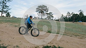 Fat bike also called fatbike or fat-tire bike in summer driving the hills