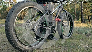 Fat bike also called fatbike or fat-tire bike in summer riding in the forest.