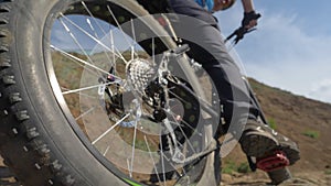 Fat bike or fatbike or fat-tire bike in summer driving on land and sand.