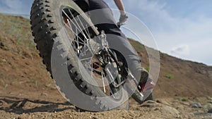 Fat bike or fatbike or fat-tire bike in summer driving on land and sand.