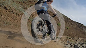 Fat bike or fatbike or fat-tire bike in summer driving on land and sand.