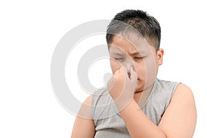 Fat boy covering his nose because of a bad foul smell