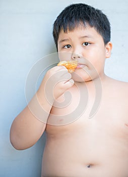 Fat boy eat deep-fried doughstick