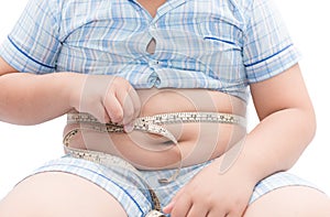 Fat boy measuring his belly with measurement tape isolated