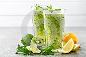 Fat burning green fruit cocktail with kiwi, lemon, mint and parsley
