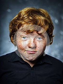 Fat freckled boy portrait