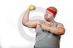 Fat funny man in red headband shows his muscles with dummbell and emotions