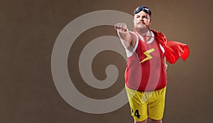 Fat funny man in a superhero costume photo