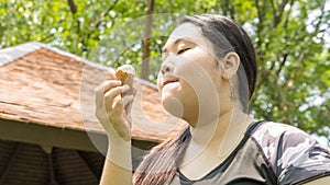 Fat girl eat ice cream in close up face feeling delicious