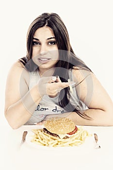 A fat girl eating fast food