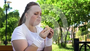 Fat girl feeling bad after eating fastfood, trying to lose weight, temptation