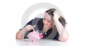 Fat girl with pink piggy bank