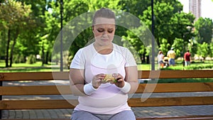 Fat girl struggles with temptation to eat burger, prefer junk food, no willpower