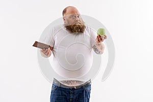 Fat guy making choice of food