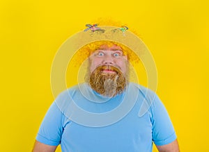Fat happy man with wig in head and sunglasses