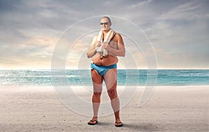 Fat man at the beach