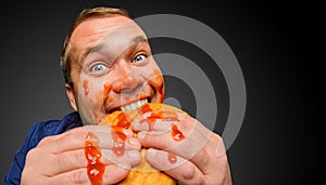 Fat man bites the tasty panini sandwich