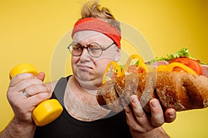 Fat man choise between sport and fastfood