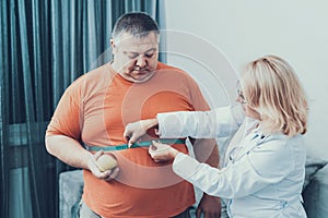 Fat Man with Doctor in White Coat in Gray Room.