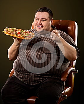 Fat man eating fast food pizza. Breakfast for overweight person.