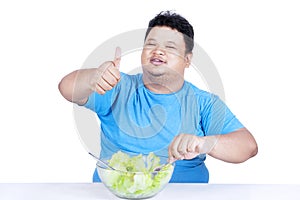 Fat man eating salad 2