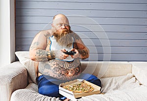 Fat man entertaining at home