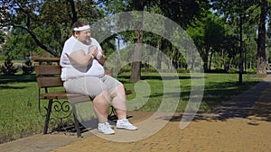 Fat man having heart attack when jogging in park, obesity causes health problems