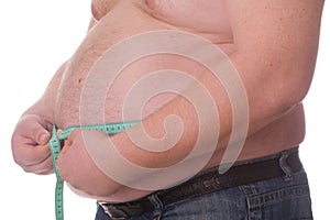 Fat man holding a measurement tape