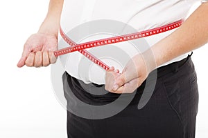 Fat man holding measurement tape