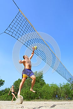 Fat man jumps to push ball