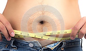 Fat man measure waist circumference photo
