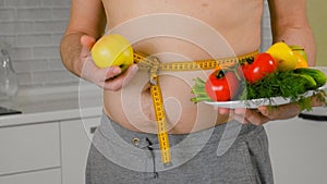 Fat man measuring his waist, healthy eating, healthy lifestyle concept, fitness diet