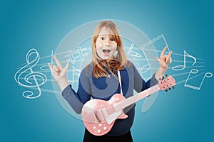 Fat red-haired girl play on guitar and has fun. Portrait is isolated on blue background