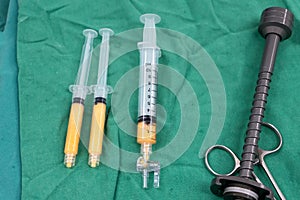 Fat syringes on the green surgical drapes for fat grafting or fa