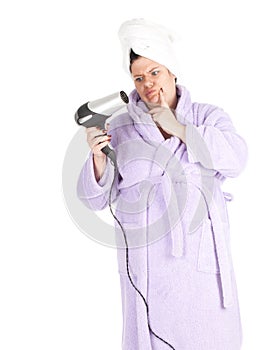 Fat woman in bathrobe keeping hair-dryer