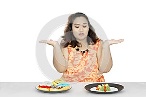 Fat woman confused to choose foods