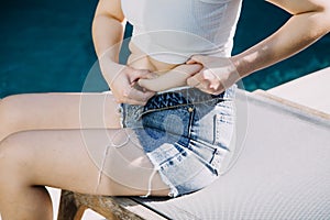 fat woman, fat belly, chubby, obese woman hand holding excessive belly fat with measure tape, woman diet lifestyle concept