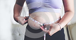 Fat woman measuring , fat woman fat belly chubby paunchy sport recreation health care lose belly fat concept, woman holding photo