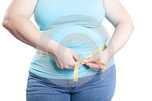 Fat woman measuring her stomach overweight, obesity