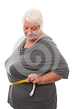 Fat woman measuring waist