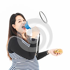 Fat woman with a megaphone and hamburger in hand