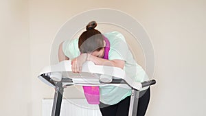 Fat woman running treadmill